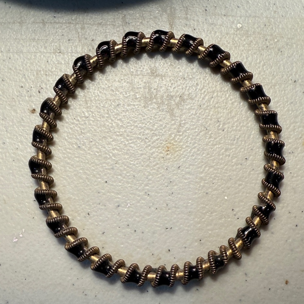 Elegant Black and Gold Twisted Design Metal Bracelet